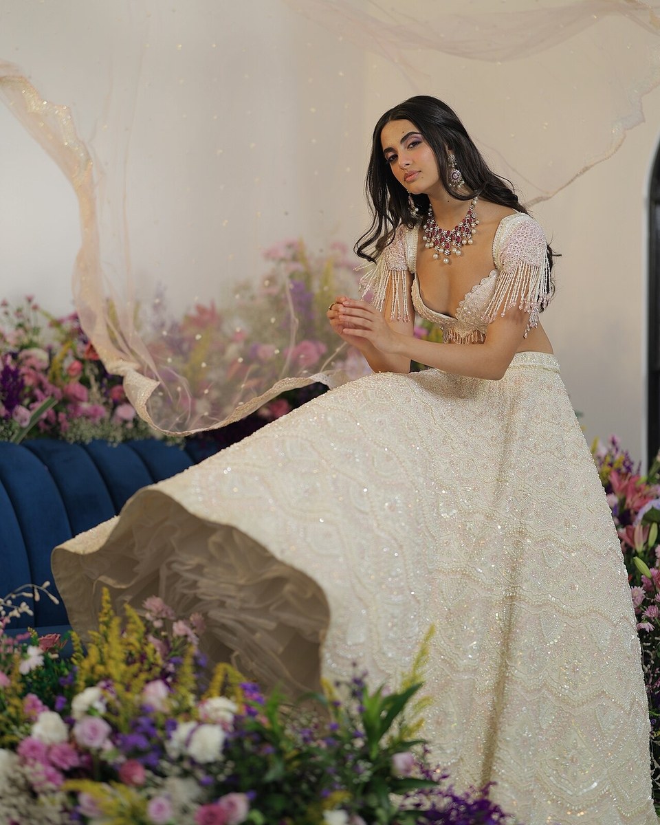 Woman in an ivory embroidered lehenga